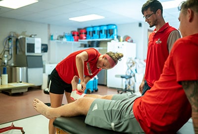 Student performing athletic training