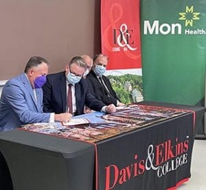 Mon Health Scholarship signing