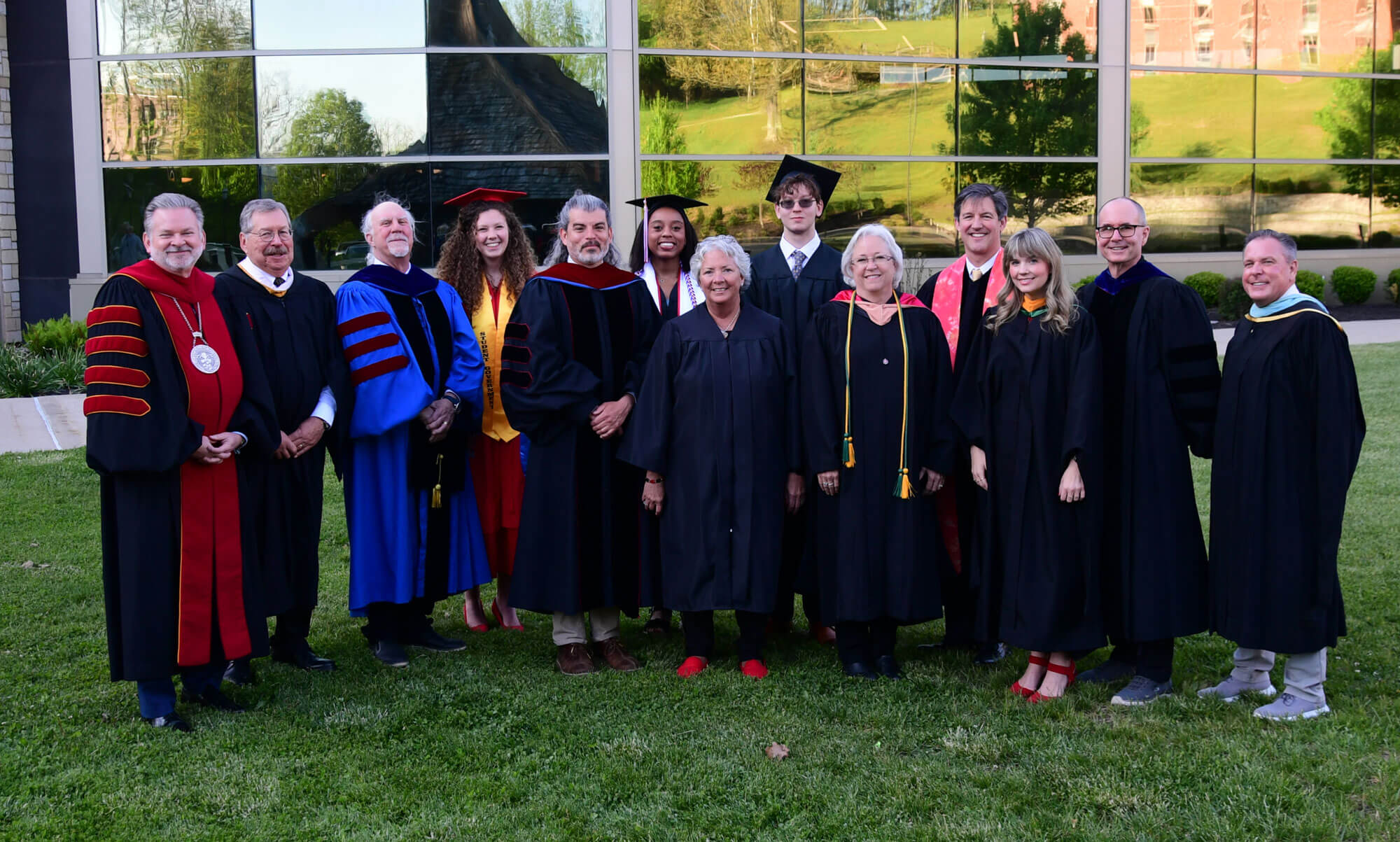 Professors and administrators at graduation.