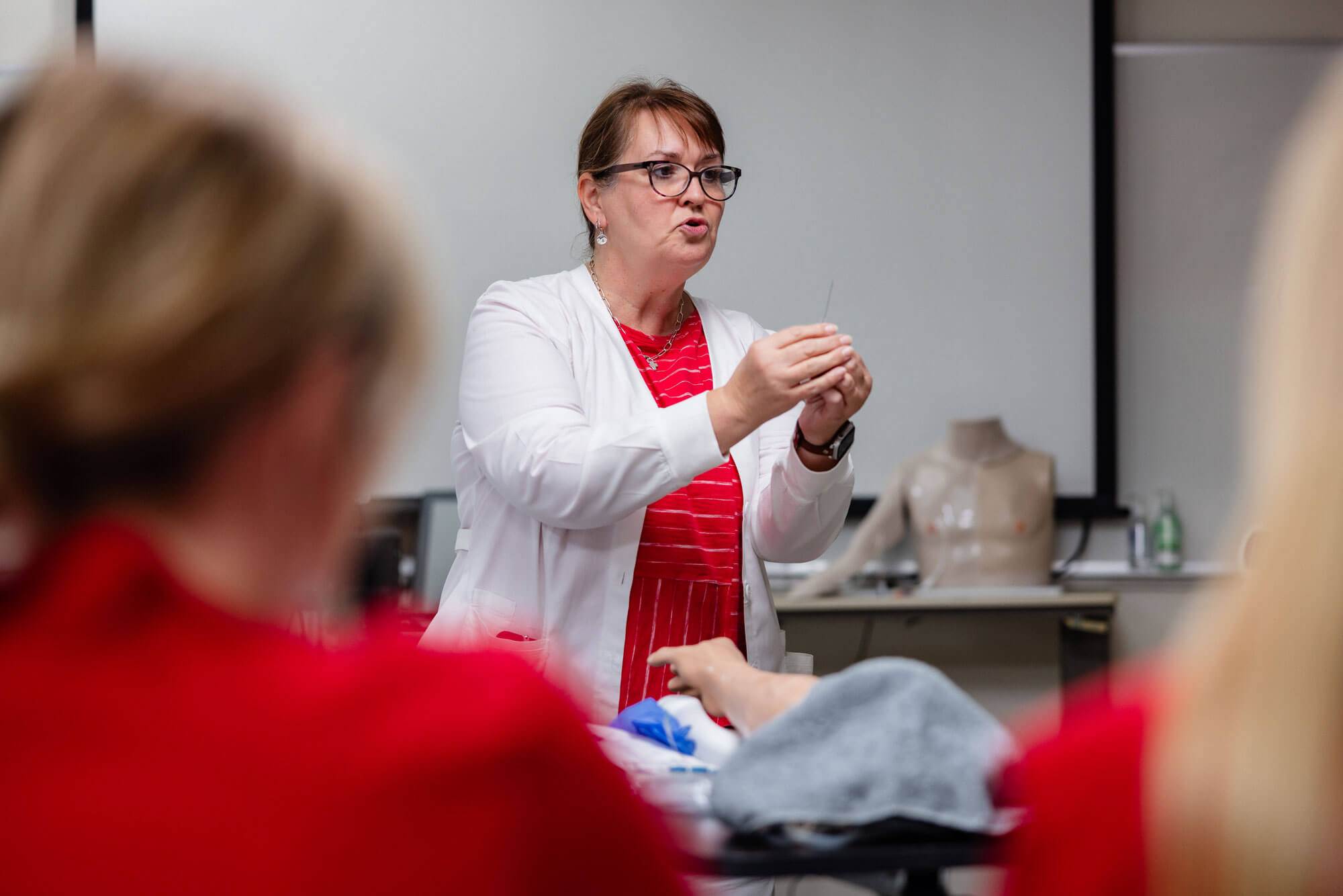 Nursing professor giving instruction