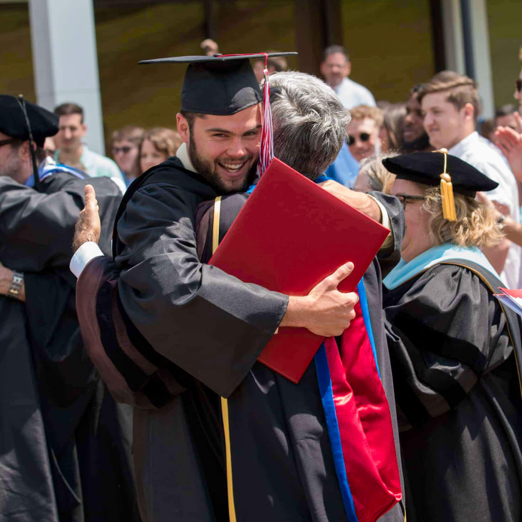 Hugging it out at graduation – and deservedly so!